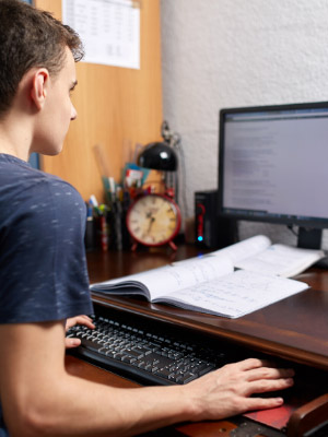 Student working on desktop computer