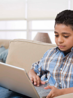Child viewing laptop computer